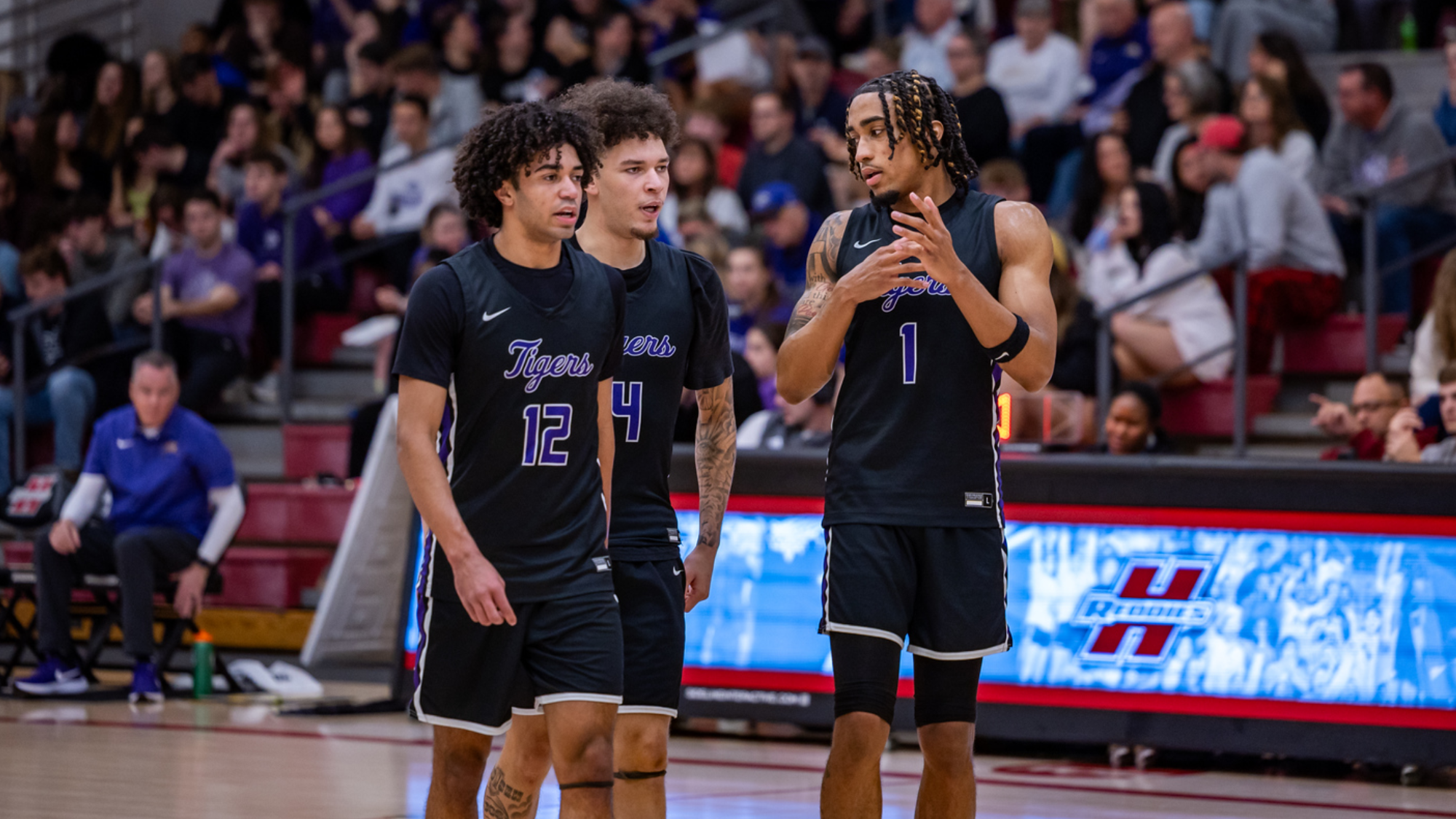 Flowers, Conley, Parks huddle at HSU 2026