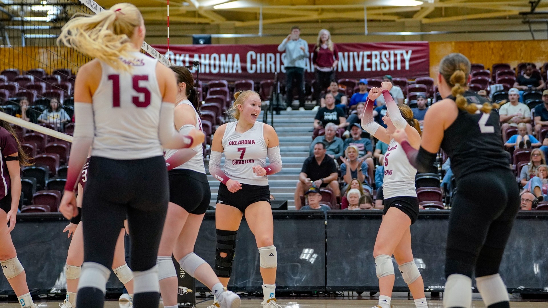 Christie celebrating on court vs. West Texas A&M