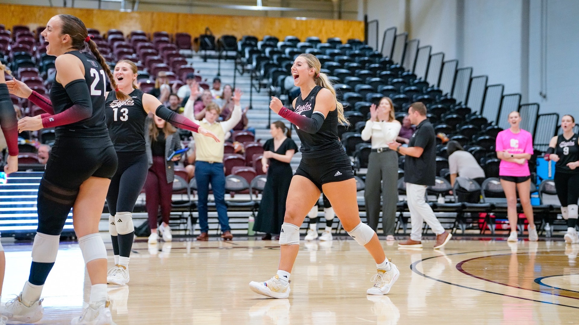 Grogan celebrating with team after point