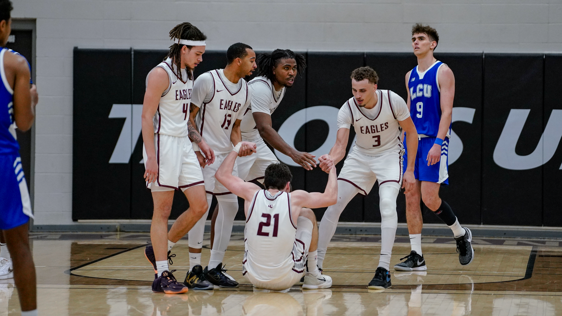 MBB teammates helping player up