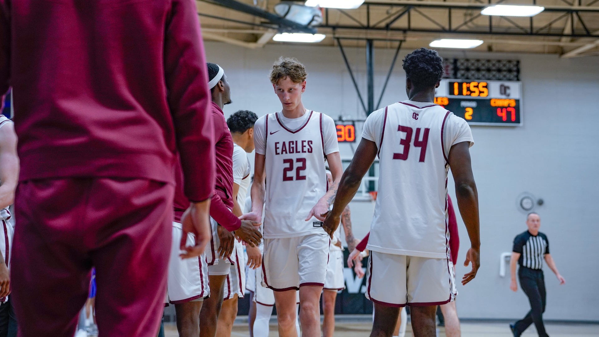 Noah Clark walking off the court to the bench