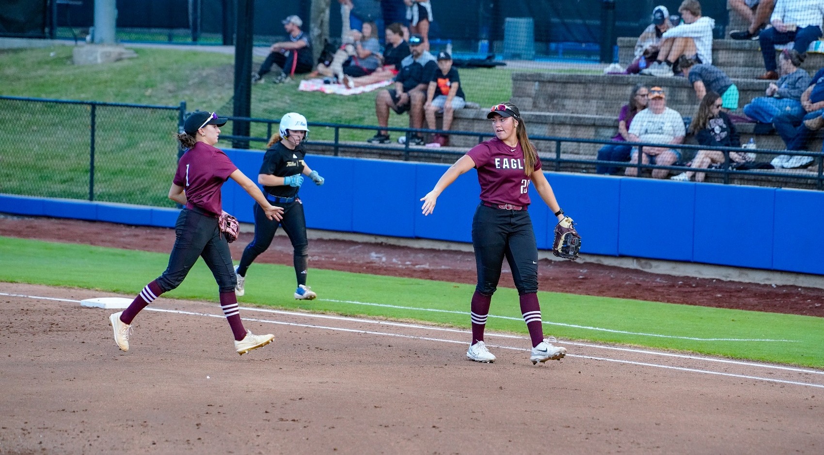Brazil and Ki. Brewster high-fiving coming off the field