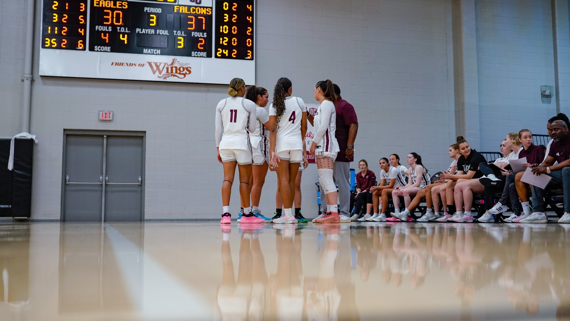 WBB team huddle on court