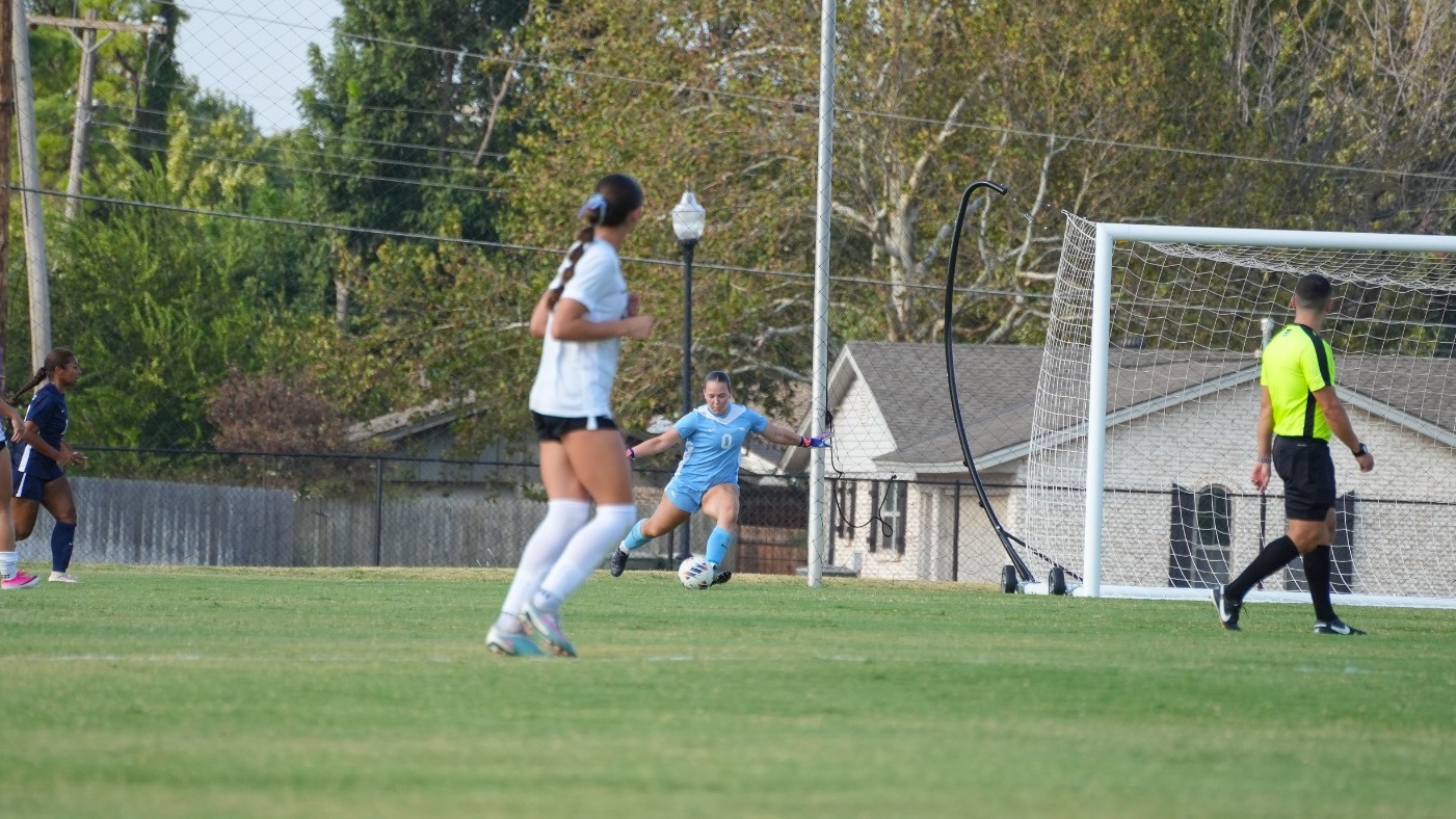 Bre Wooten launches a goal kick in the 2026 season wearing a powder blue goalkeeper kit