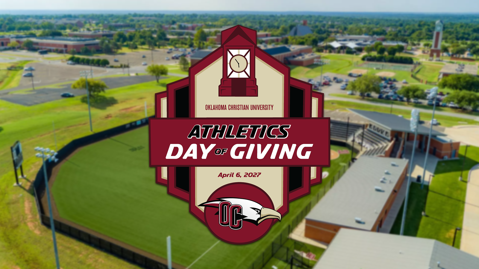 Day of Giving Logo with New Date of April 6, 2027, on a blurred drone shot of oklahoma christian's softball field looking southeast