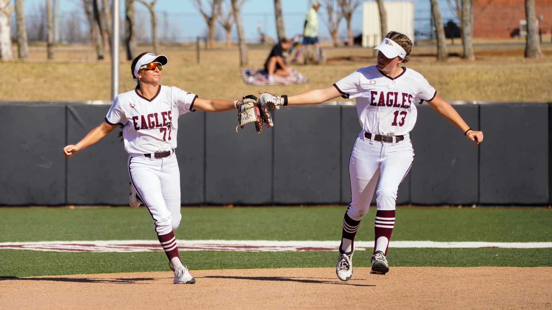 Ka. Brewster and McDougal high-fiving