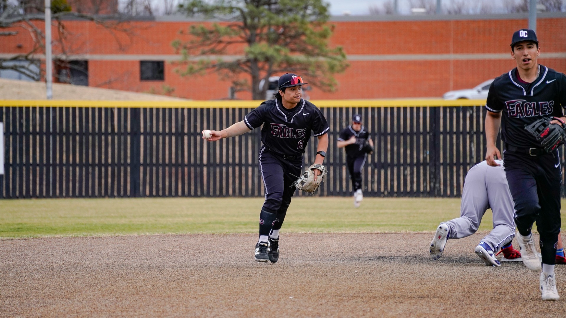 Elijah Laus throwing ball to ump after getting runner out