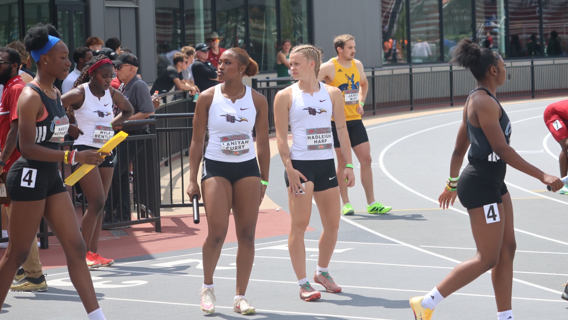 Curry and Harp standing together on track