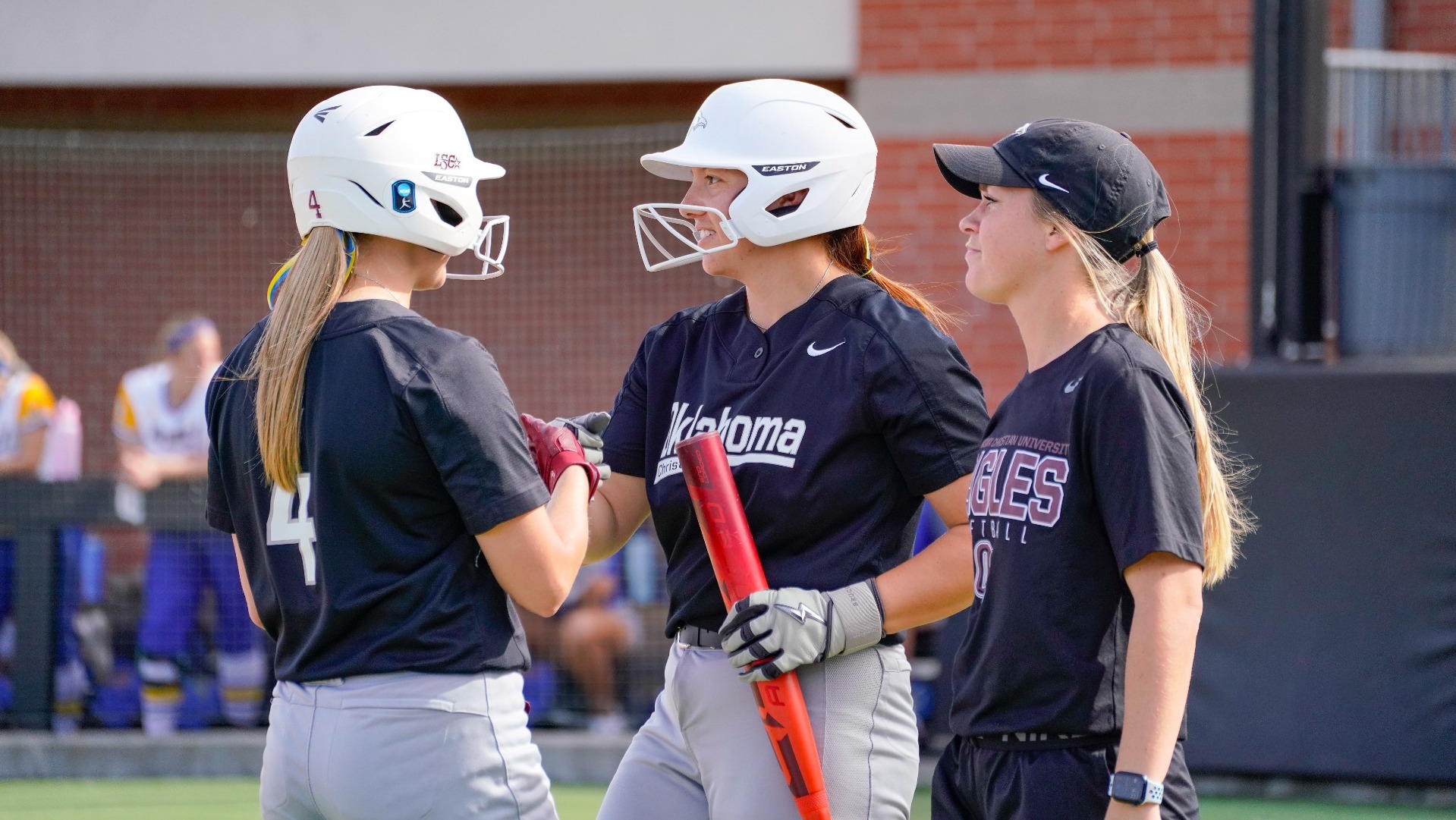 Coach Rodriguez with Maci and Danae