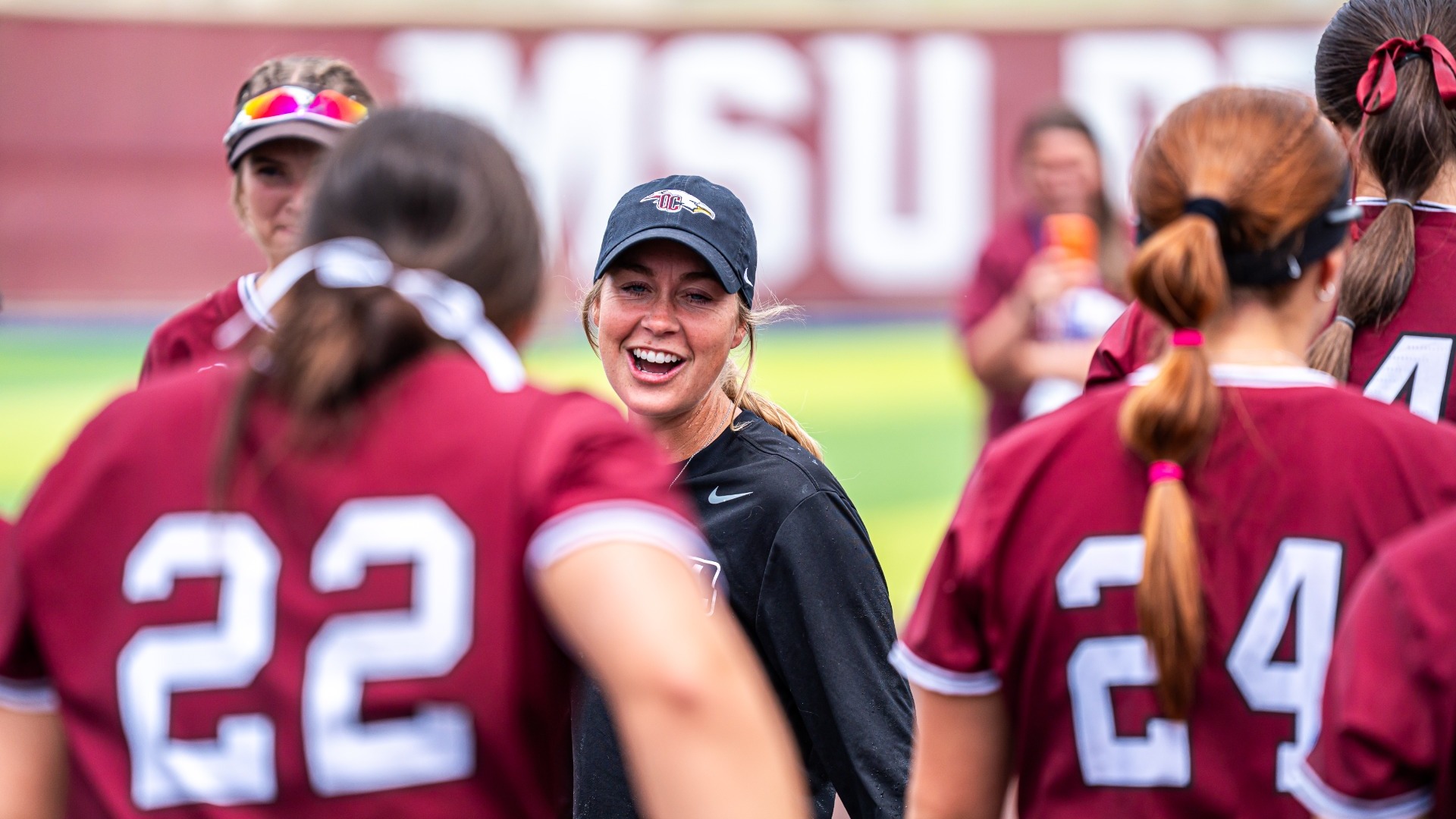 Coach Rodriguez celebrating with team