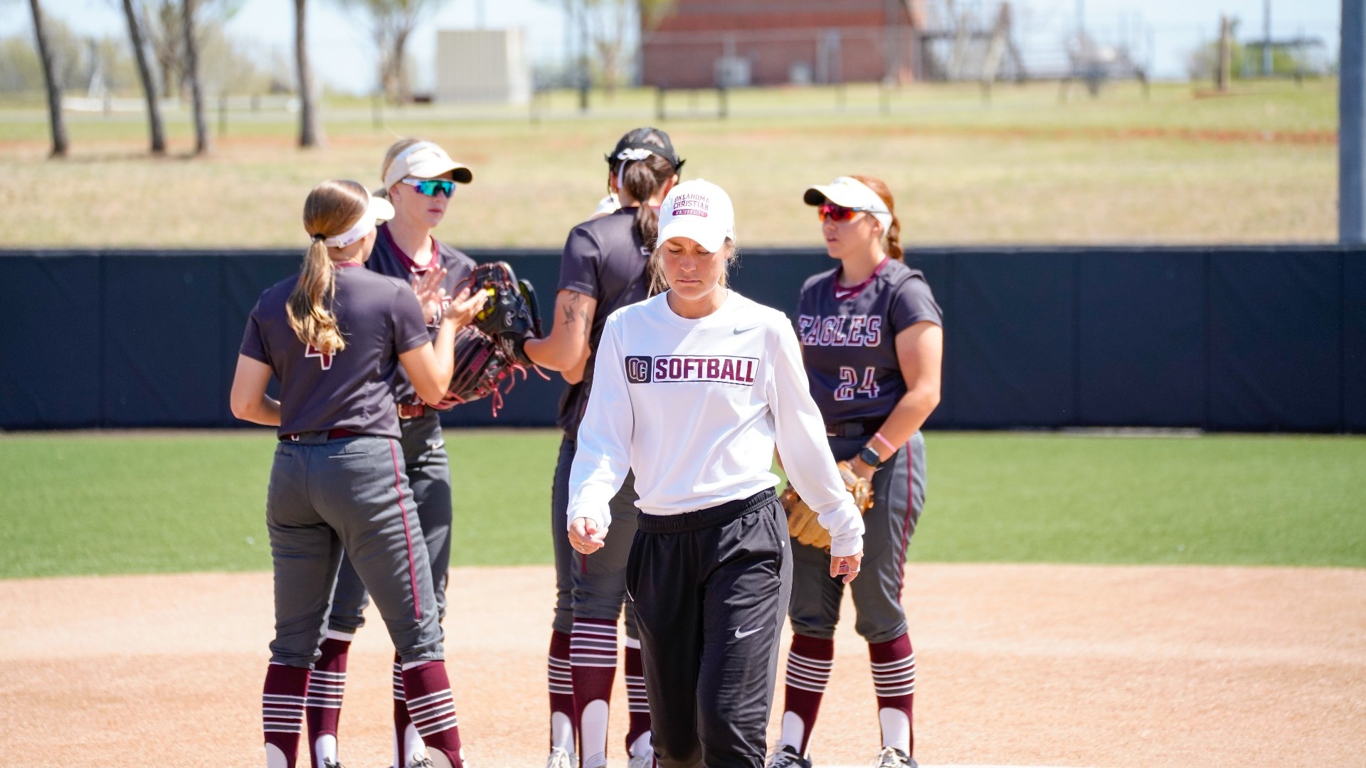 Coach Rodriguez walking away from circle visit