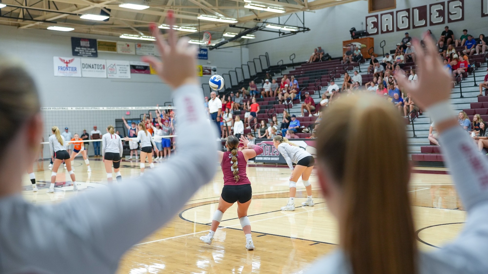 Bench Holds Up Talons Up Hand Sign during a serve in the Nest