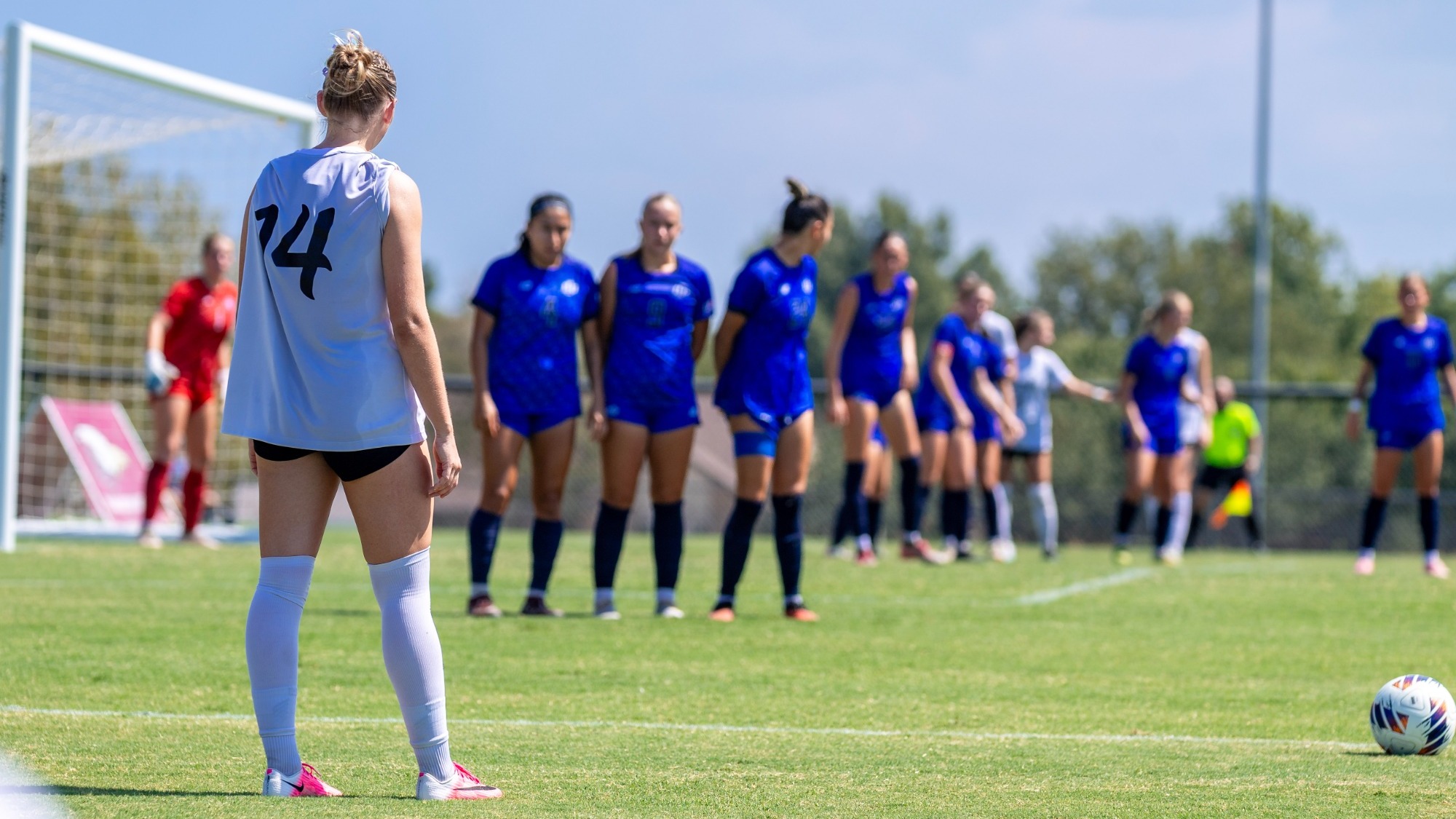 Jordan Tanges Stares at a wall of defenders just outside the 18-yard box before a free kick