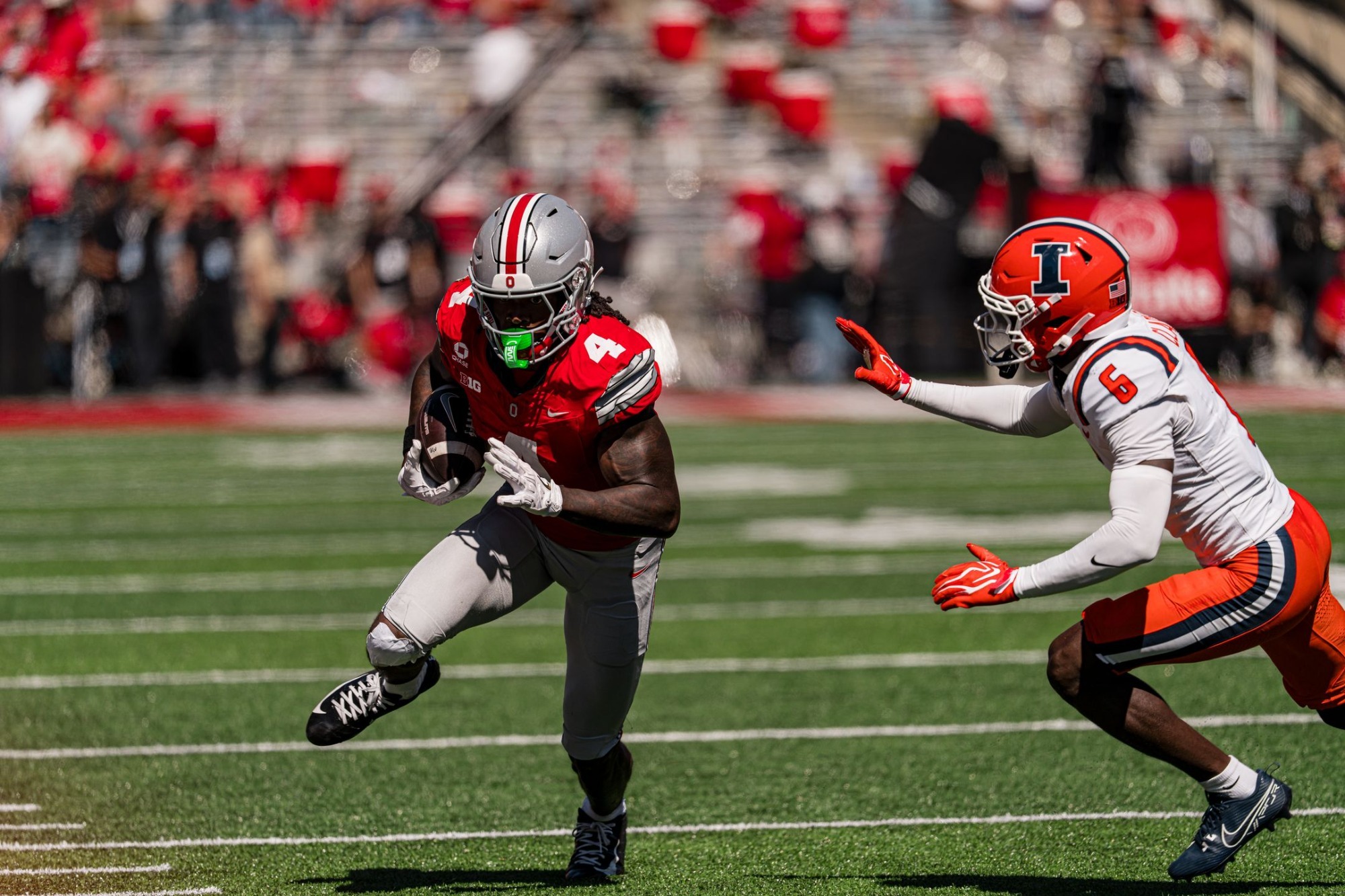 Jeremiah Smith carries the ball against Illinois during his 217-yard four-touchdown performance for Ohio State