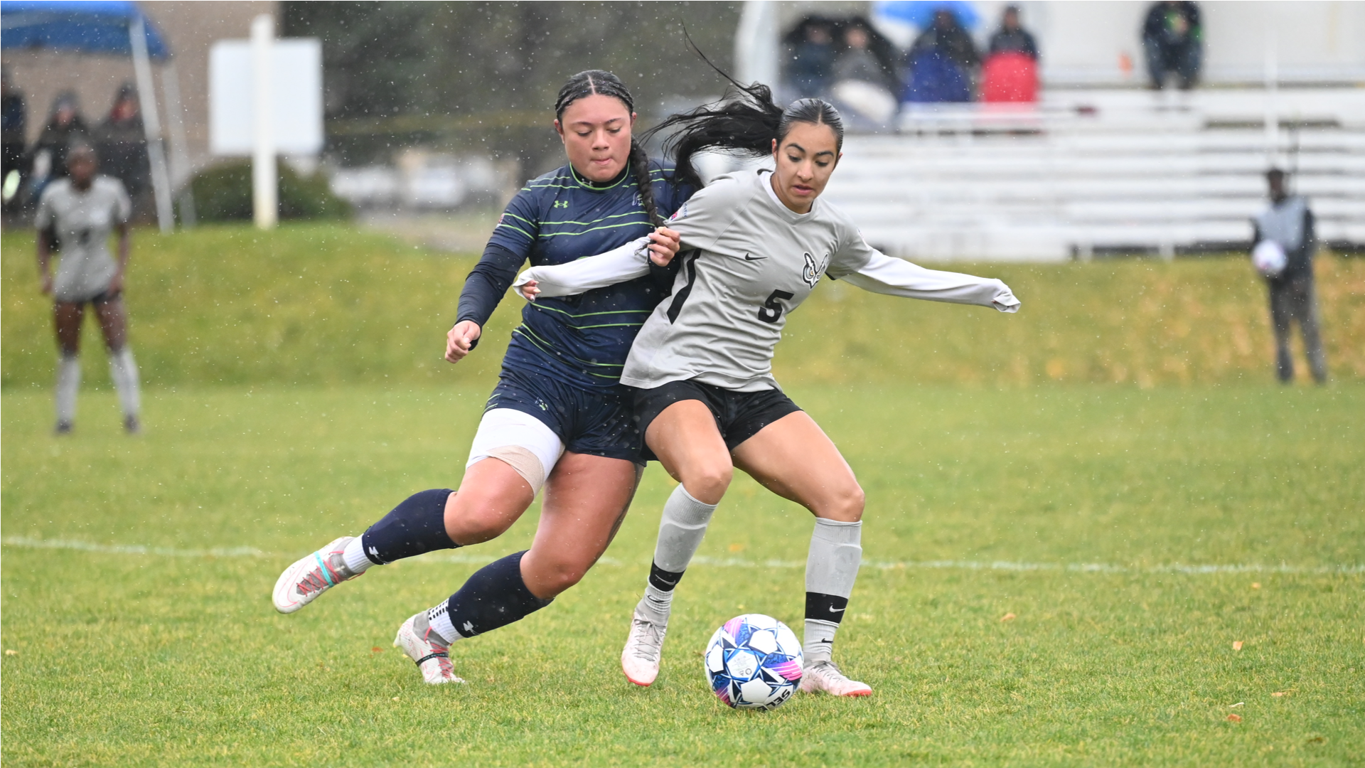 Soccer Players battling for ball
