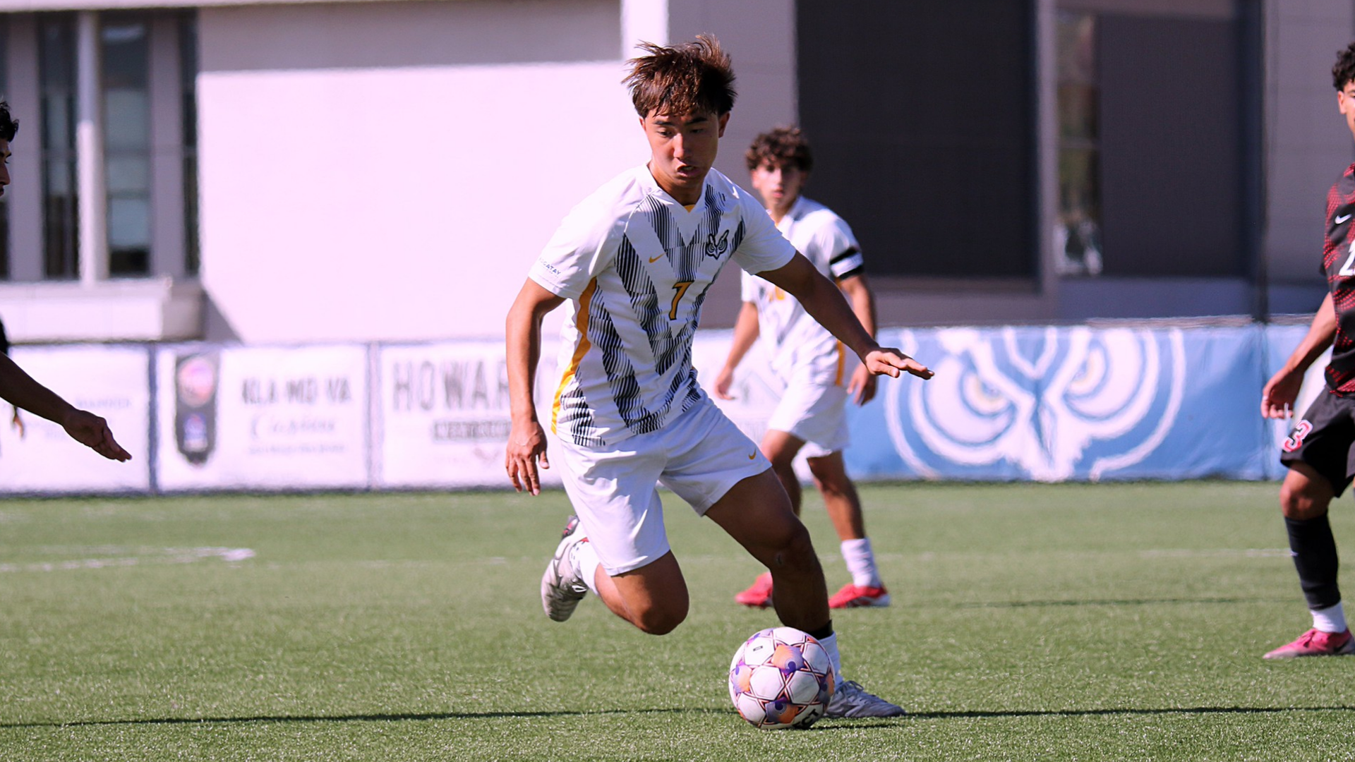 Soccer player kicking ball