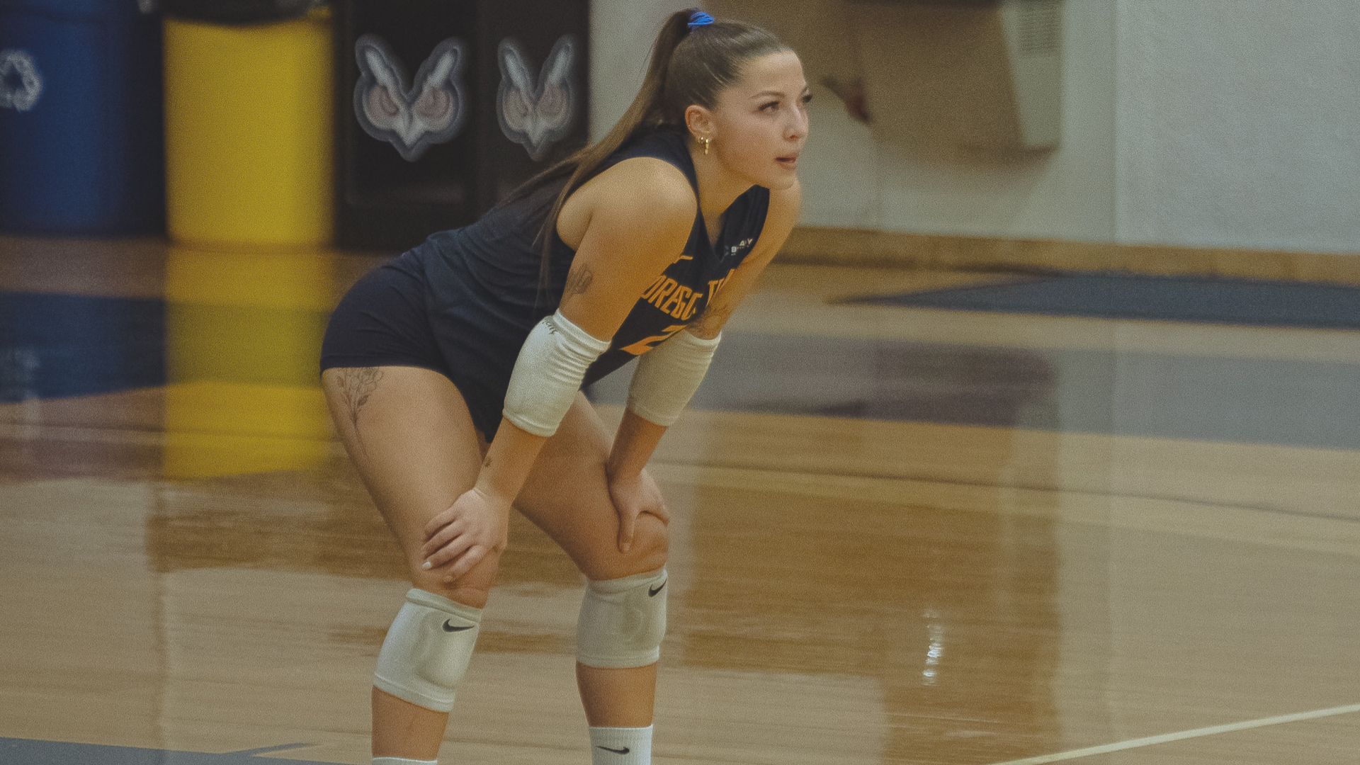 Player with hands on knees