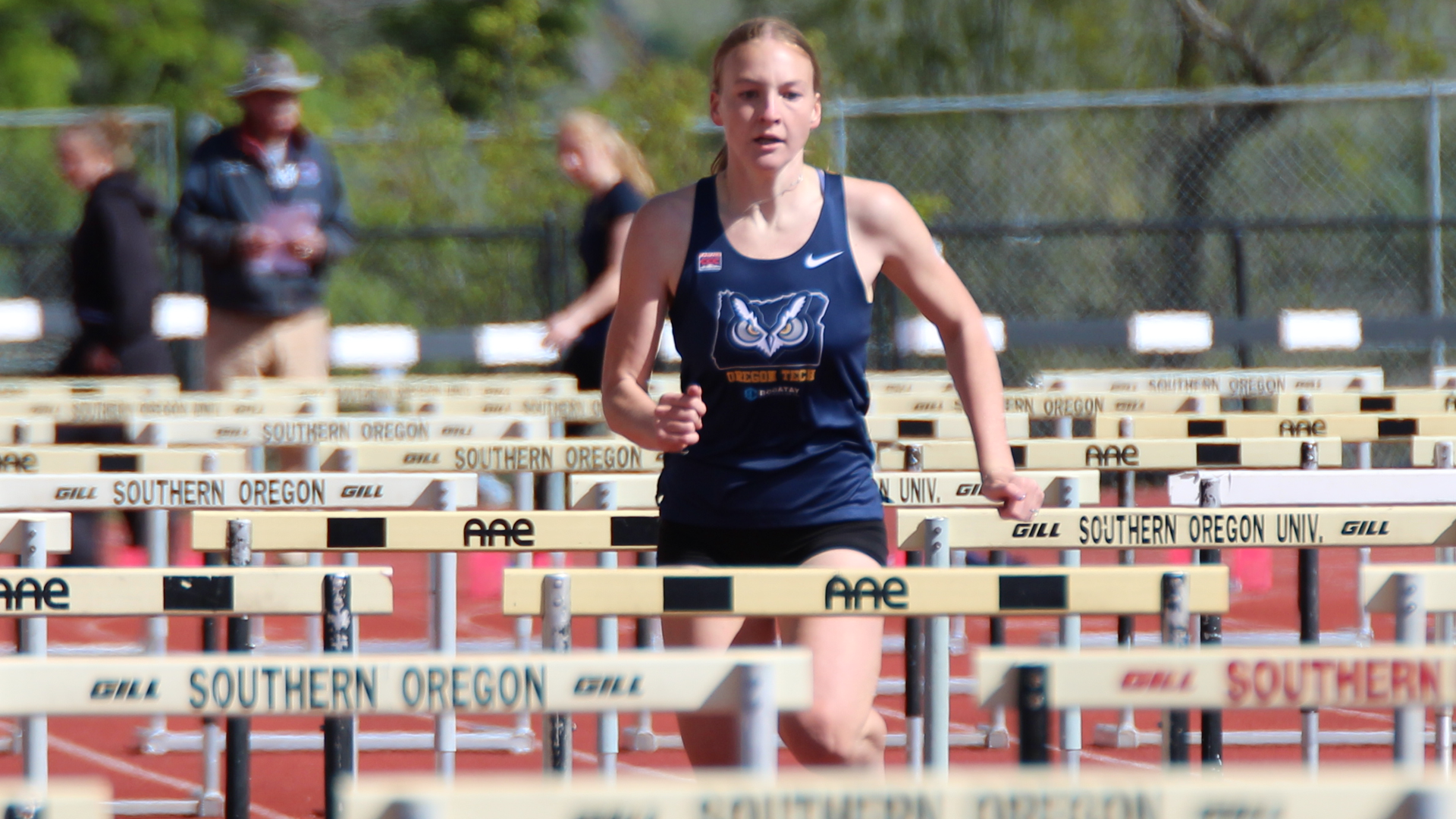Lily Everson running the hurdles