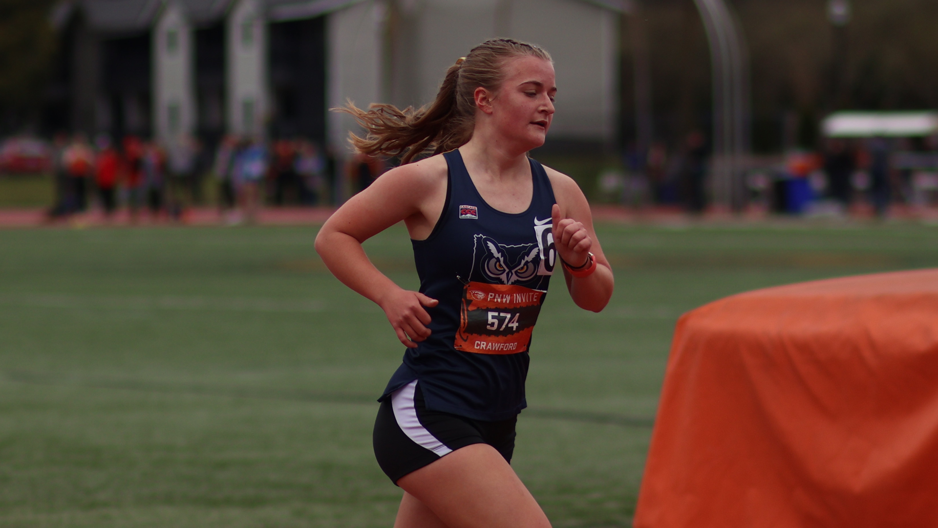 Chloe Crawford runnng on a track