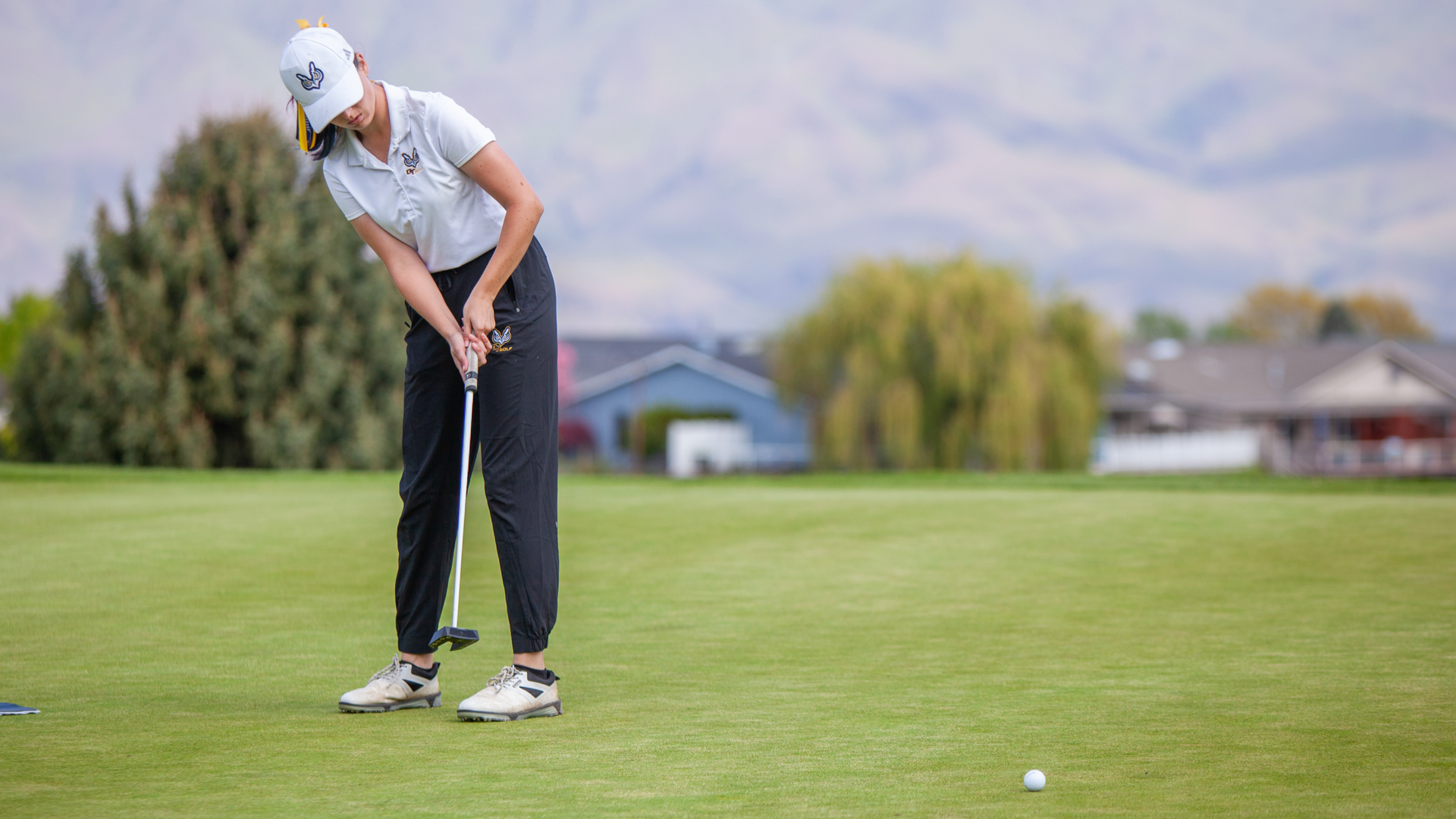 OIT Player Putts on Green
