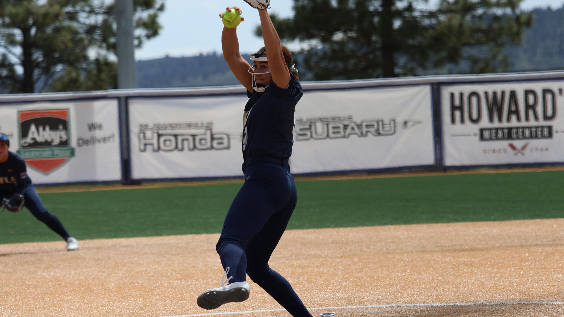 Alli Parker throwing a pitch vs. Bushnell
