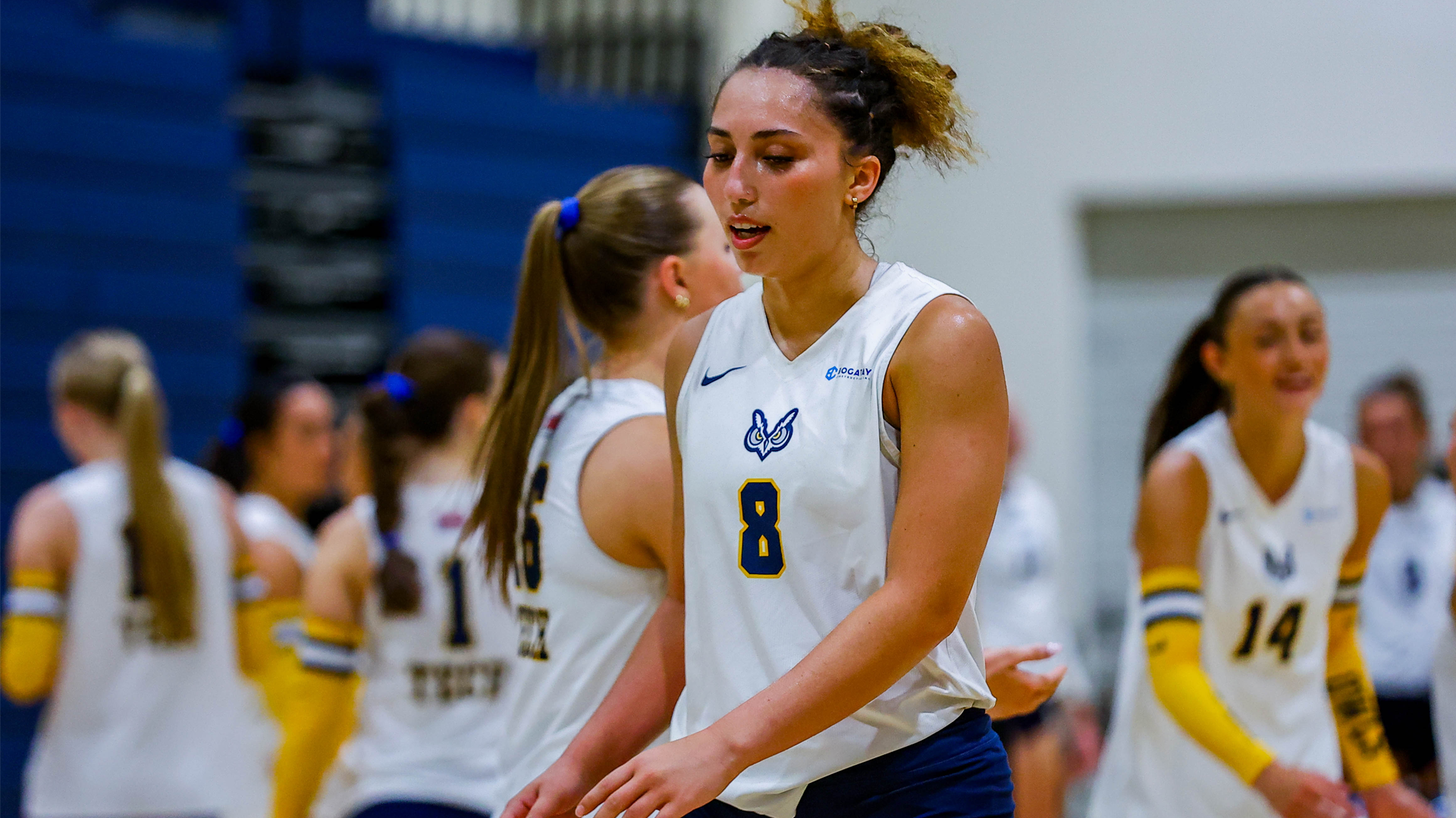 Player walking to huddle at VB game