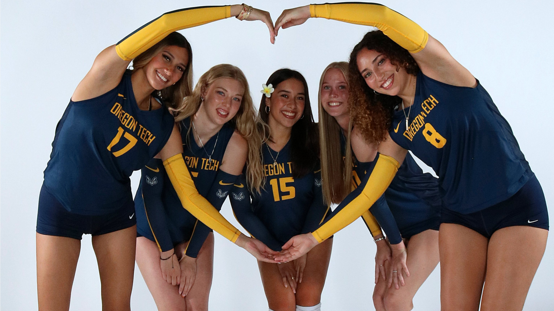 Players making a heart posing