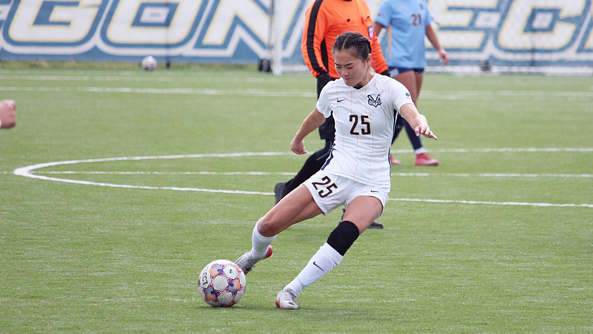 Kaylie Hashizaki kicking a soccer ball