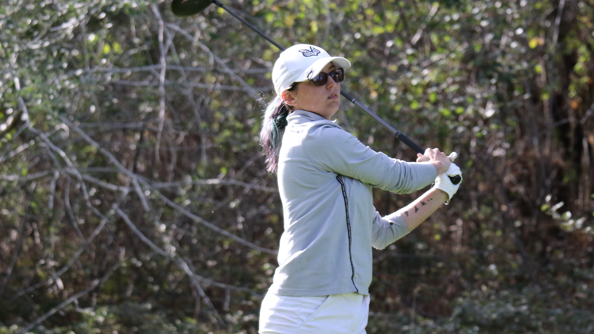 Madison Dick swinging golf club