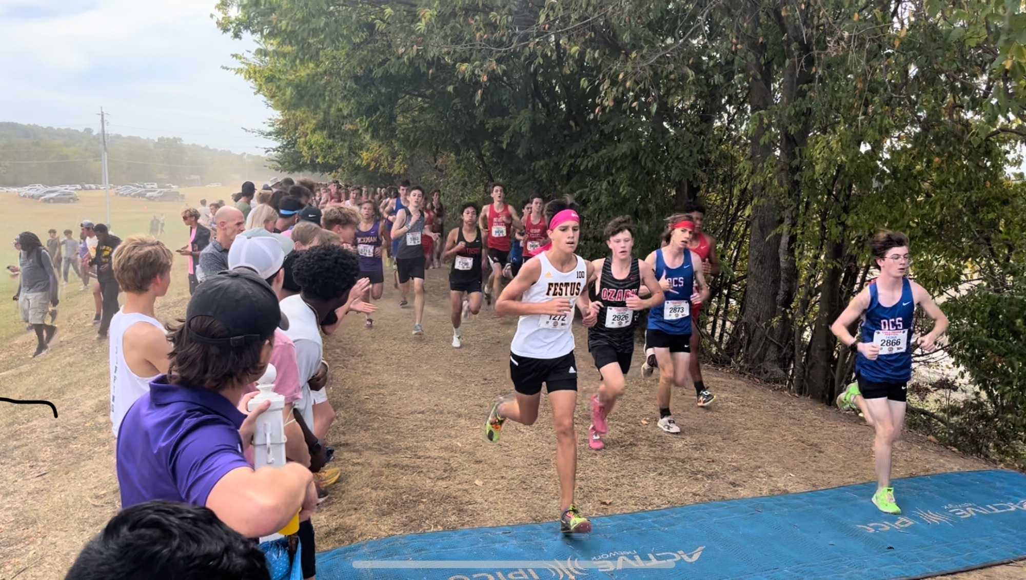 Senior runner Jake Ruse and Freshman runner Ben Baker running at the Chile Pepper Cross Country Festival