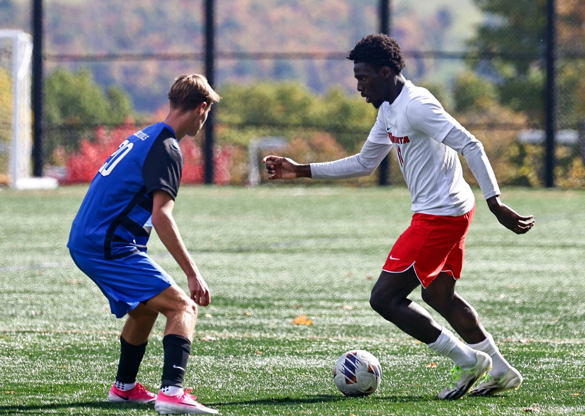 Yacouba Bamba looks to move the ball past a Fredonia defender