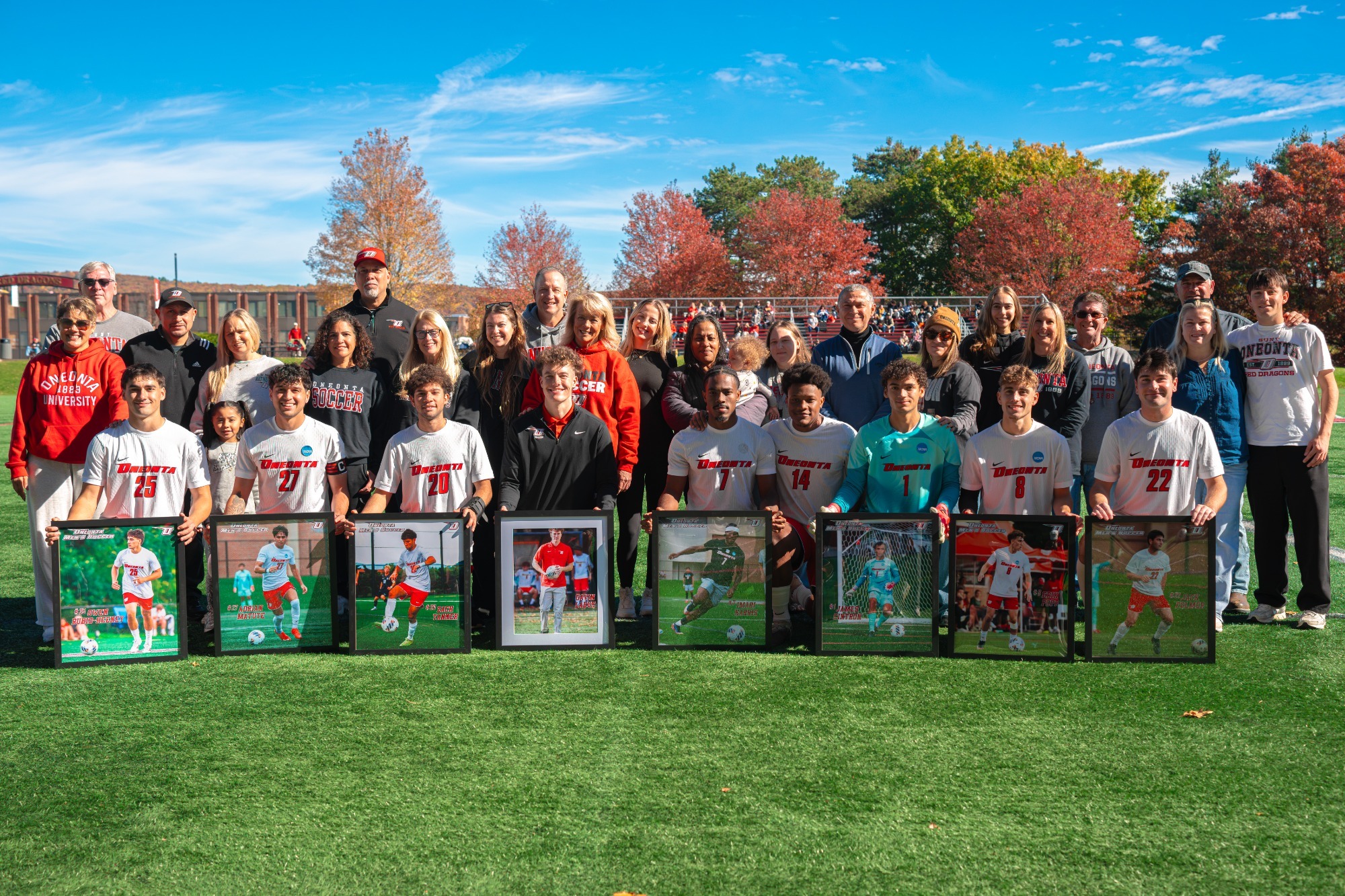 Men's Soccer Seniors lined up with their family for Senior Day