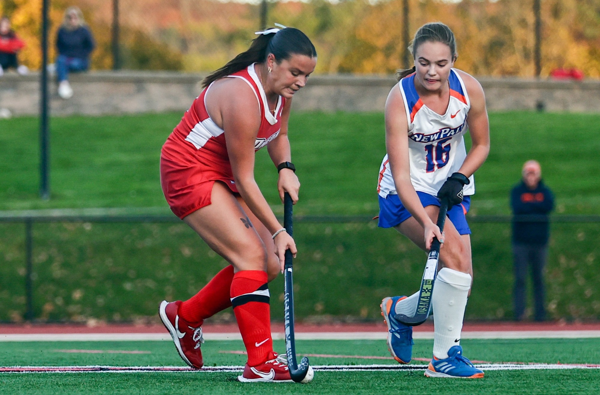 Alexandra Howell looks to hit the ball past a New Paltz defender towards the cage 