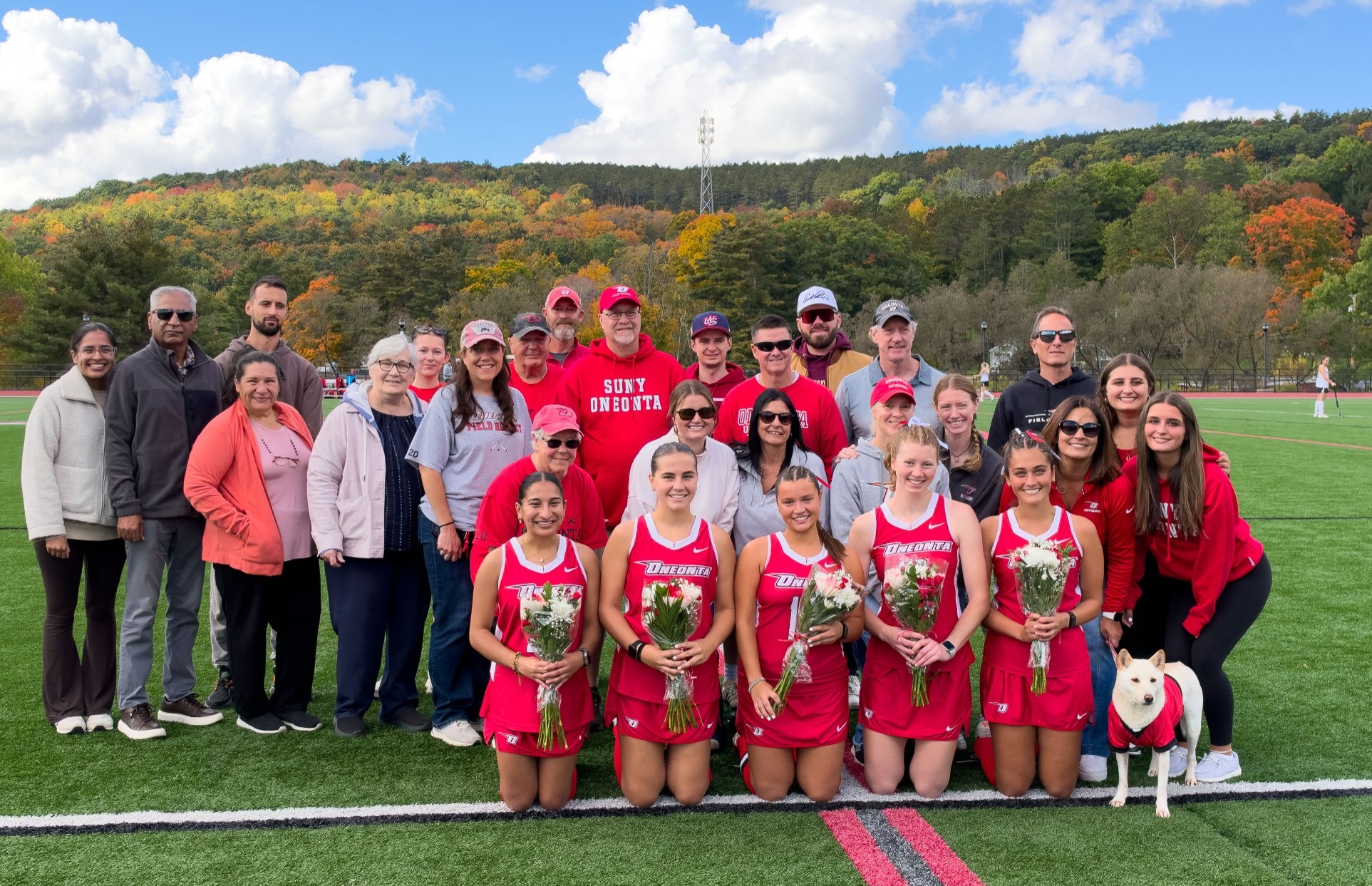 Field Hockey Seniors pictured with their family on Senior Day 2026