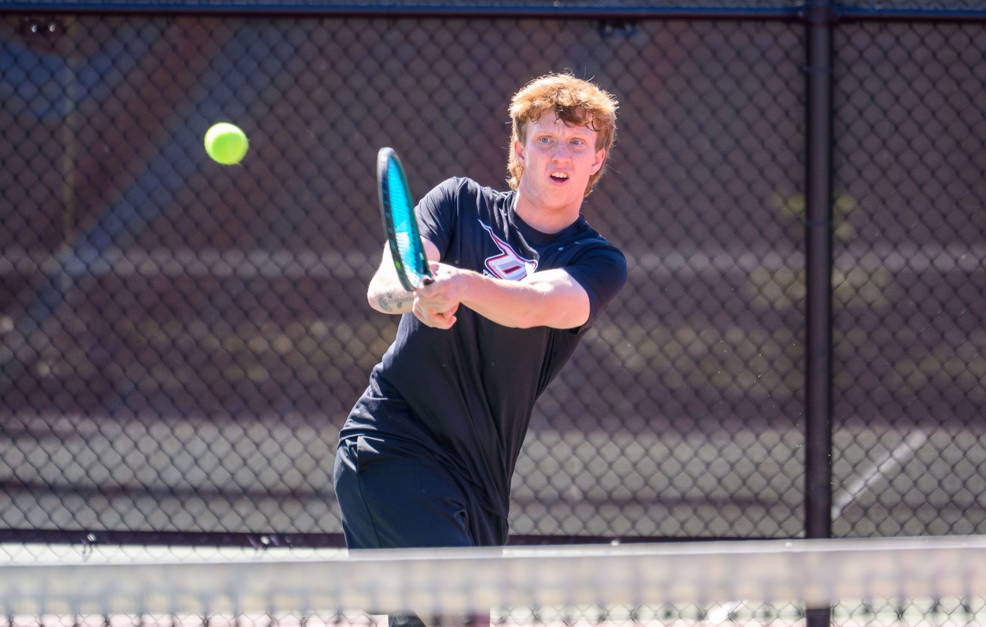 Sean Lippman retuns a shot against Farmingdale