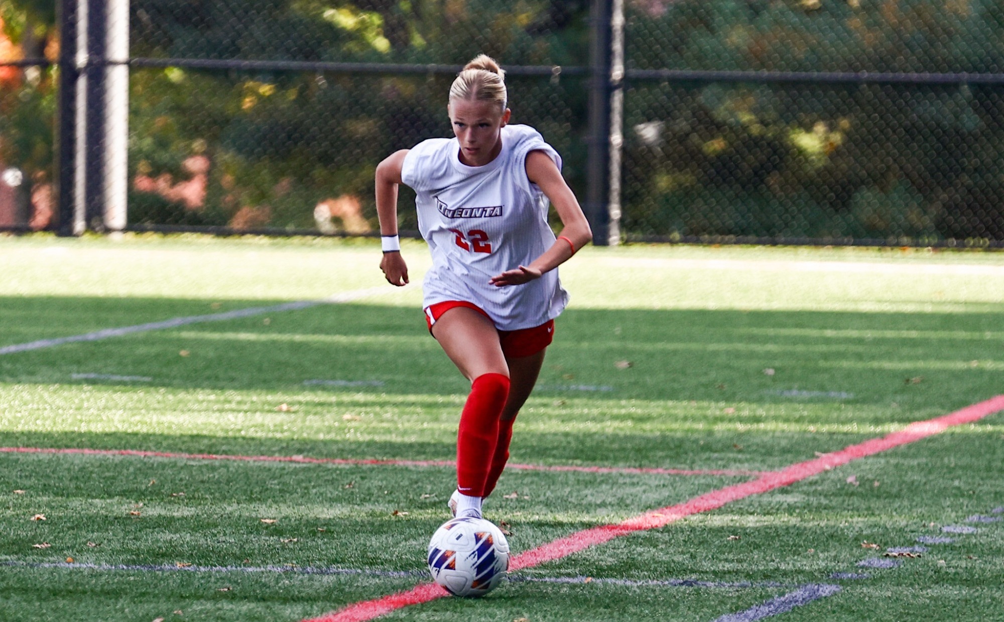 Lily Martin moves the ball up the field against Plattsburgh