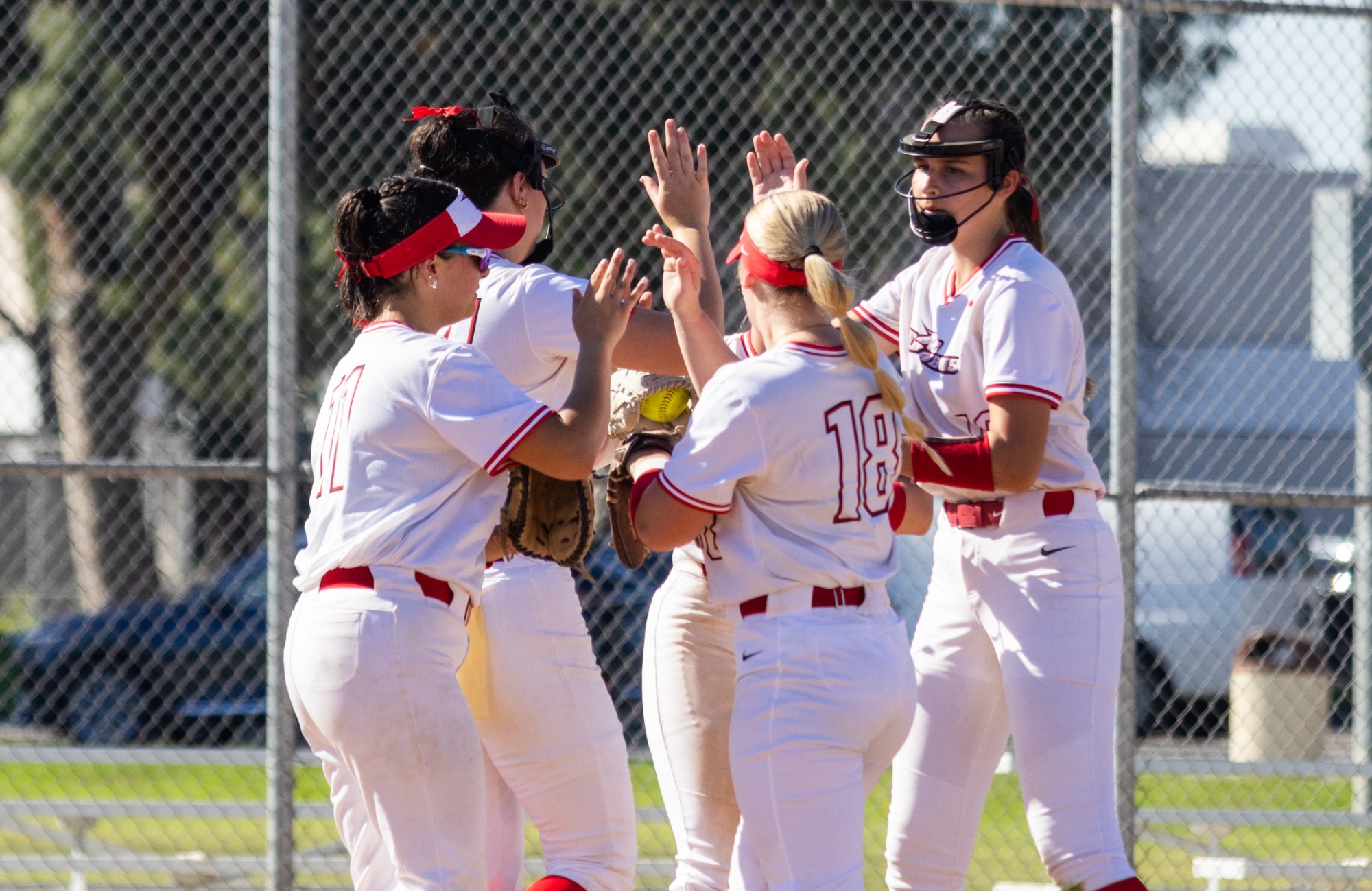 Softball infielder's visit in the pitching circle at Chapman