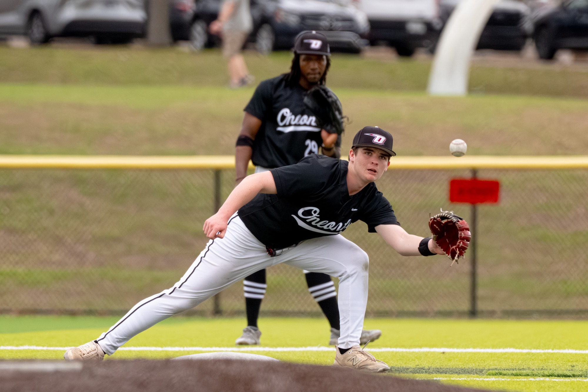 Ryan Cronin catches a ball while on second base