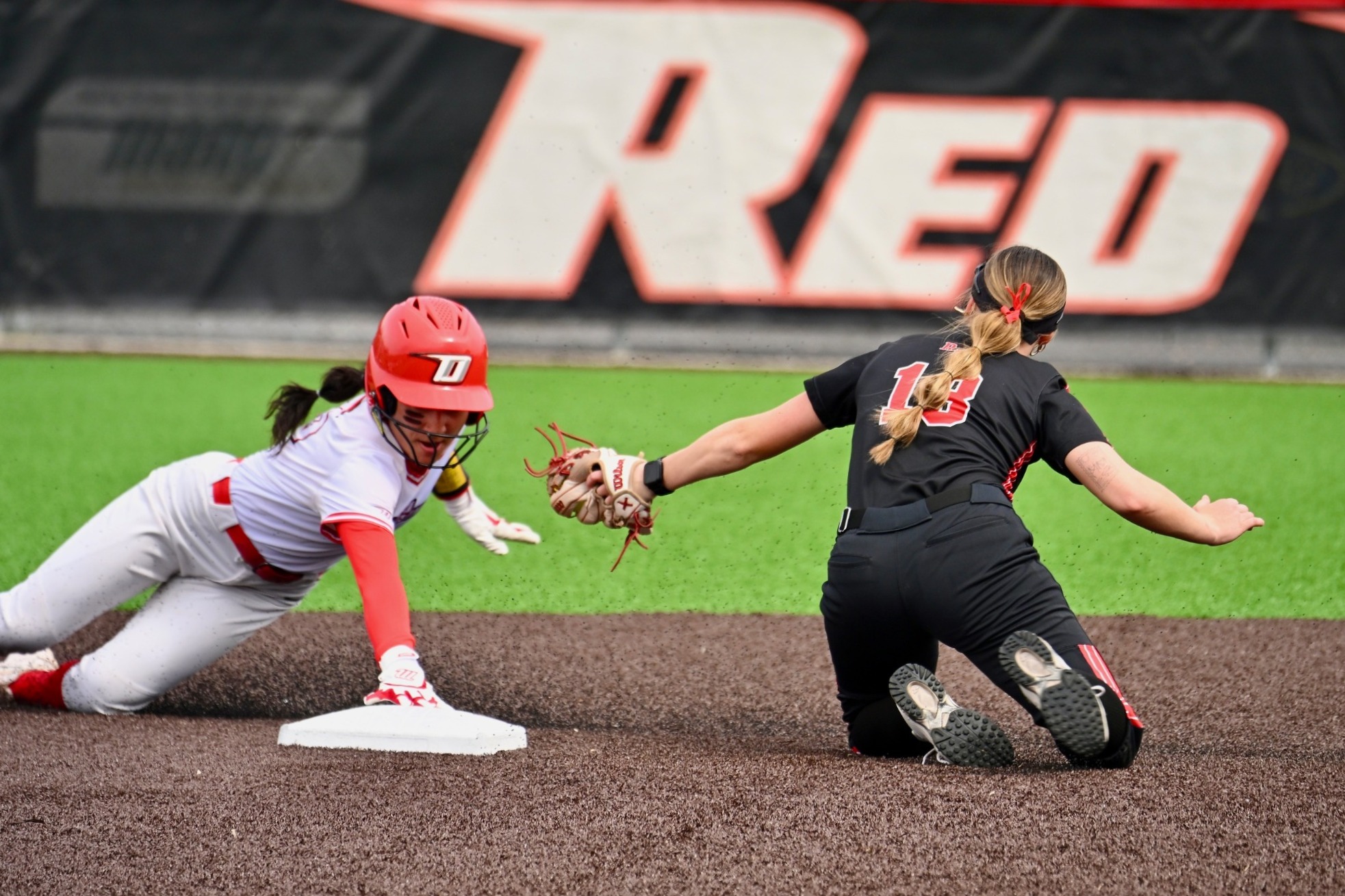 Sophia Camacho slides past an RPI infielder as she steals second