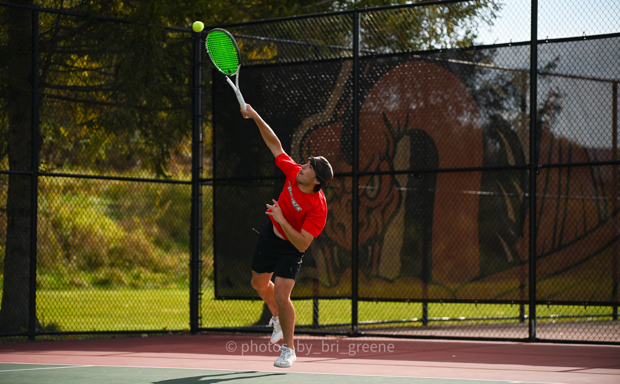 Nate Inzerillo serving the ball against Marywood