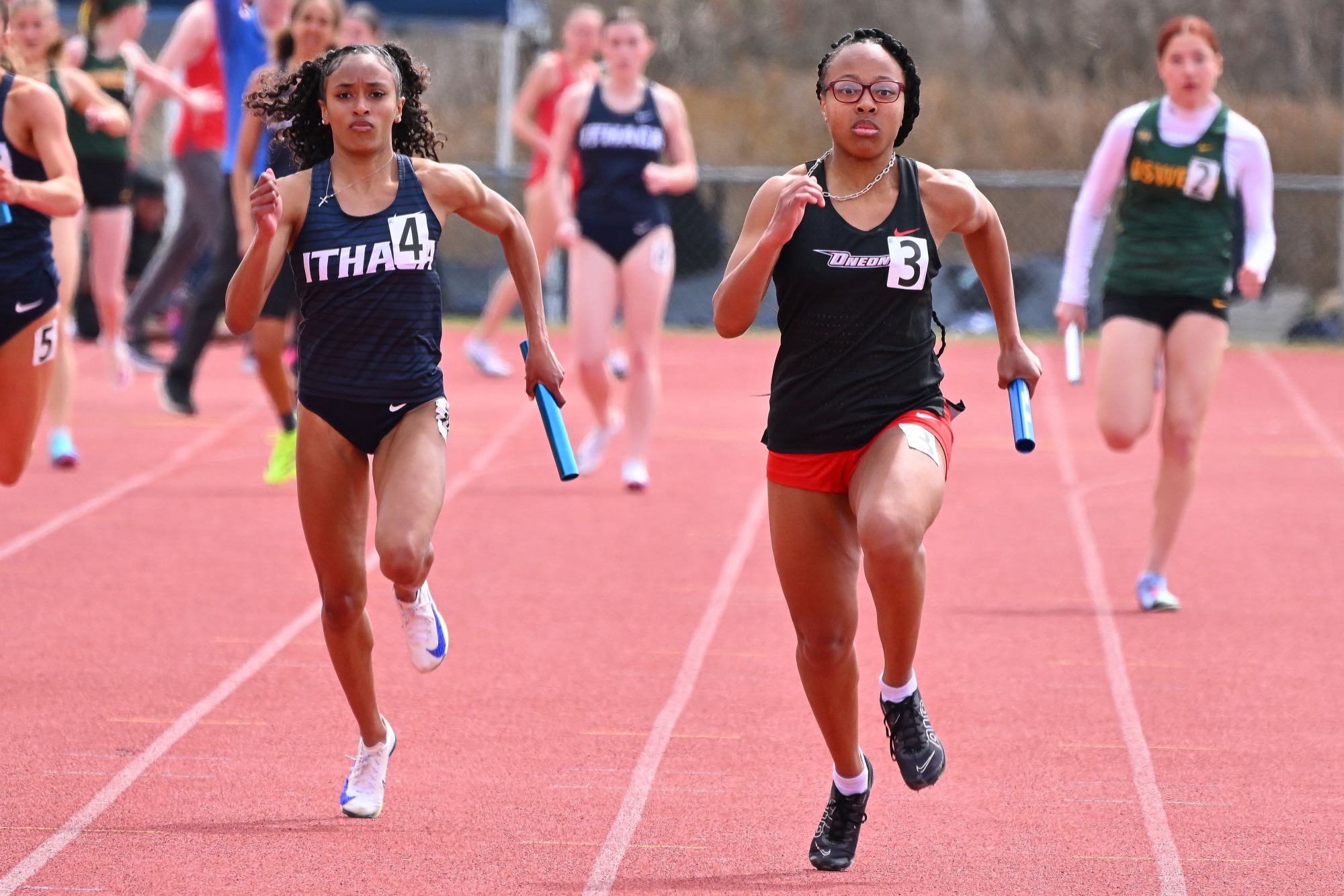 Nicolette DuBose running in the 4x100 relay at the Cortland Red Dragon Open
