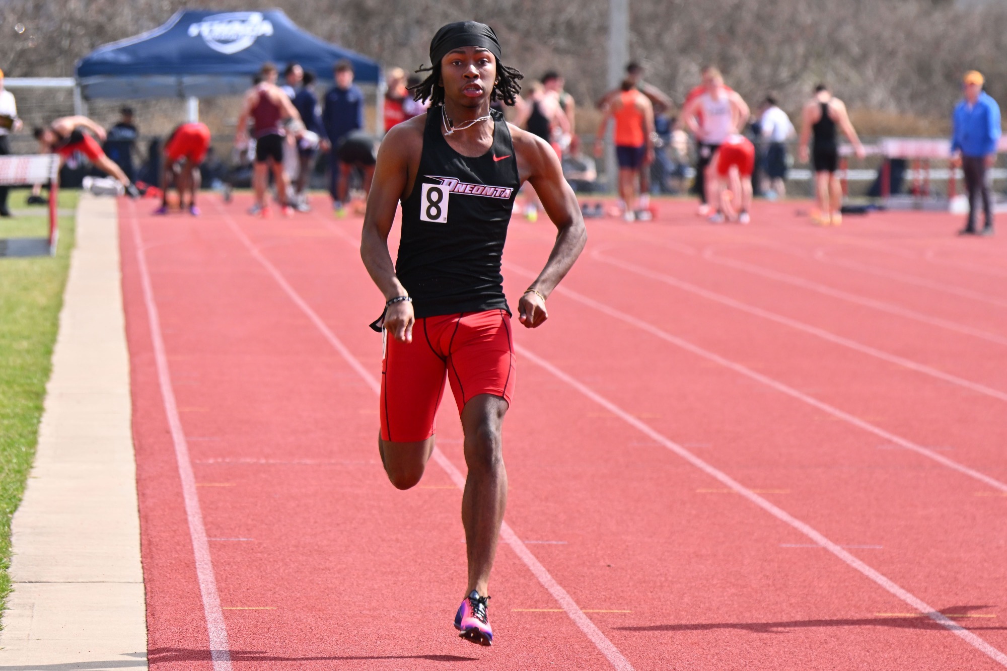 Amir Mceachin sprinting in the 100 at the Cortland Red Dragon Open