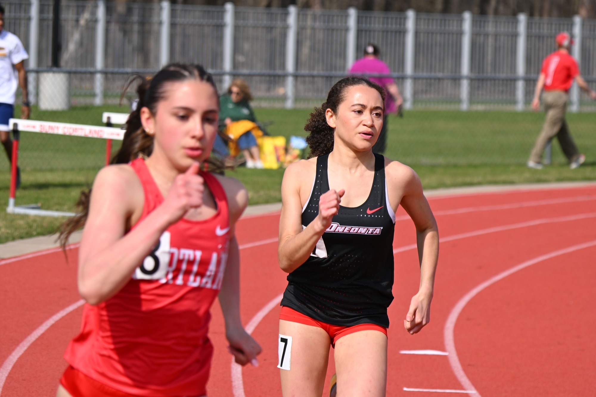 Natalia Sweat coming around the bend in the 400 at the Cortland Red Dragon Open