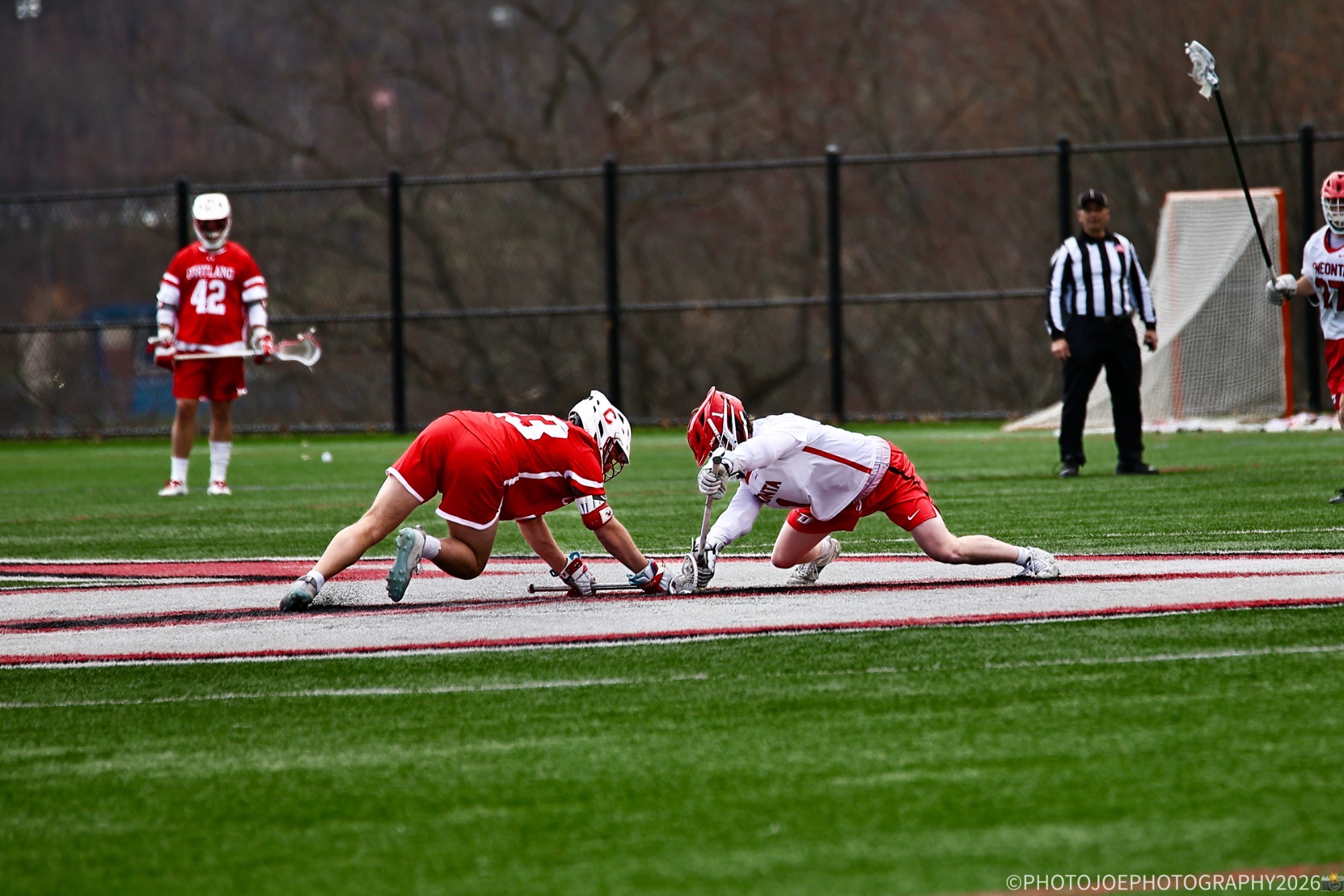 Sean Grimes takes a faceoff against Cortland