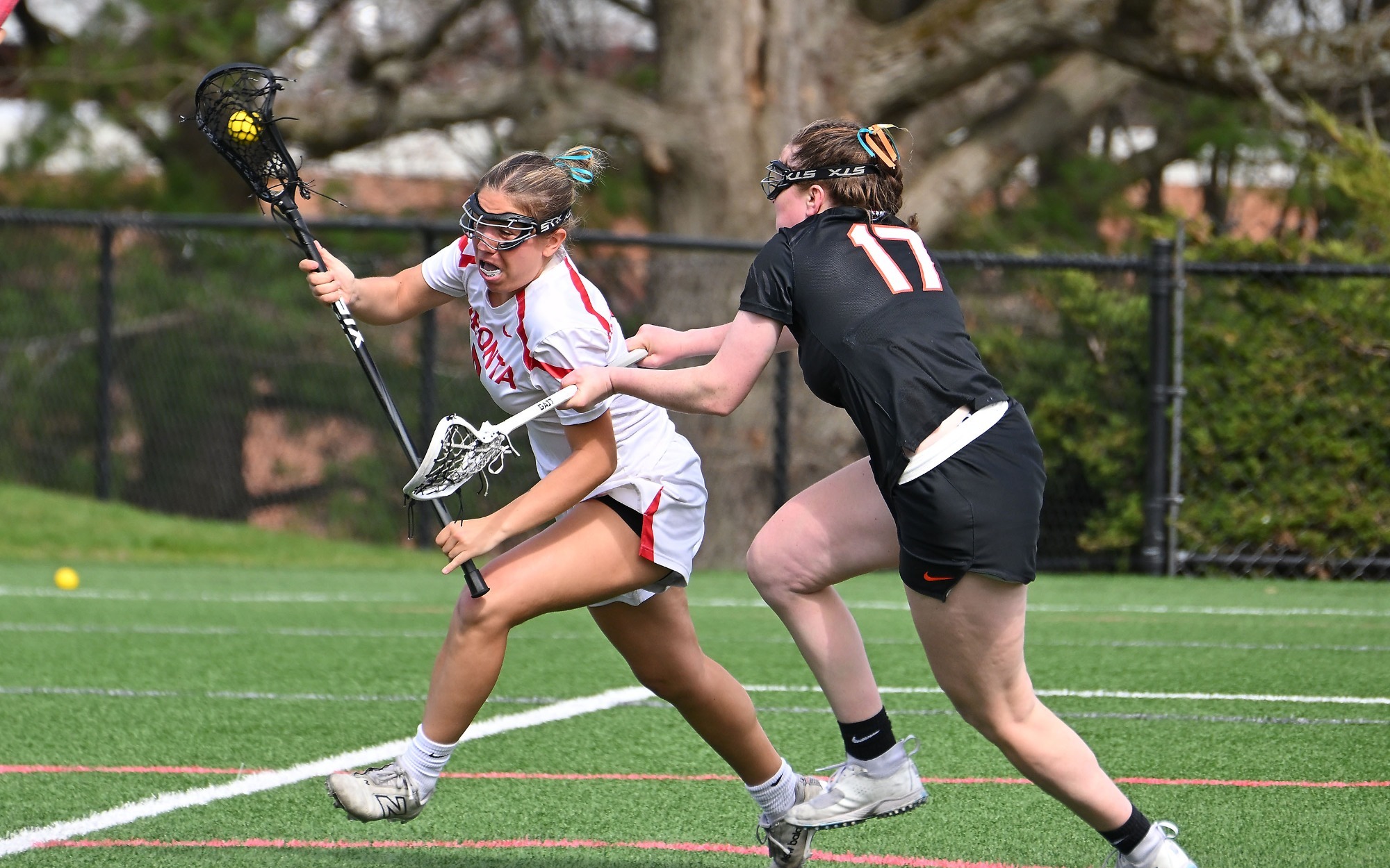 Angelina Weinert drives past a Buffalo State defender