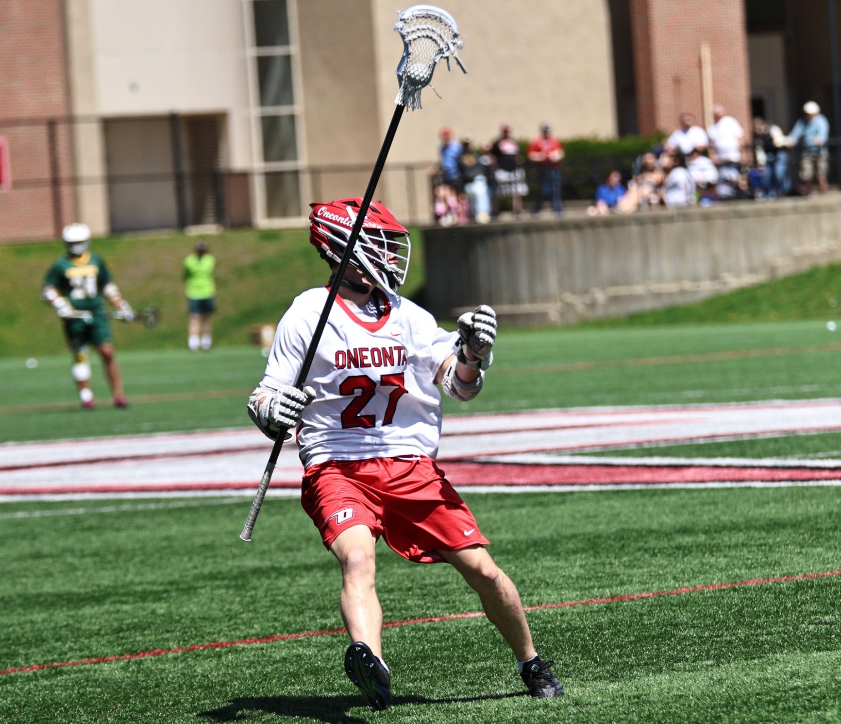 Aidan Greene carries the ball against Oswego
