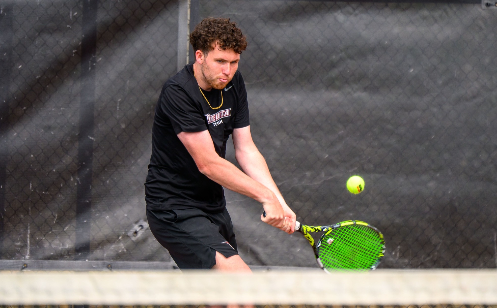 Will Schmid returns a shot against Farmingdale