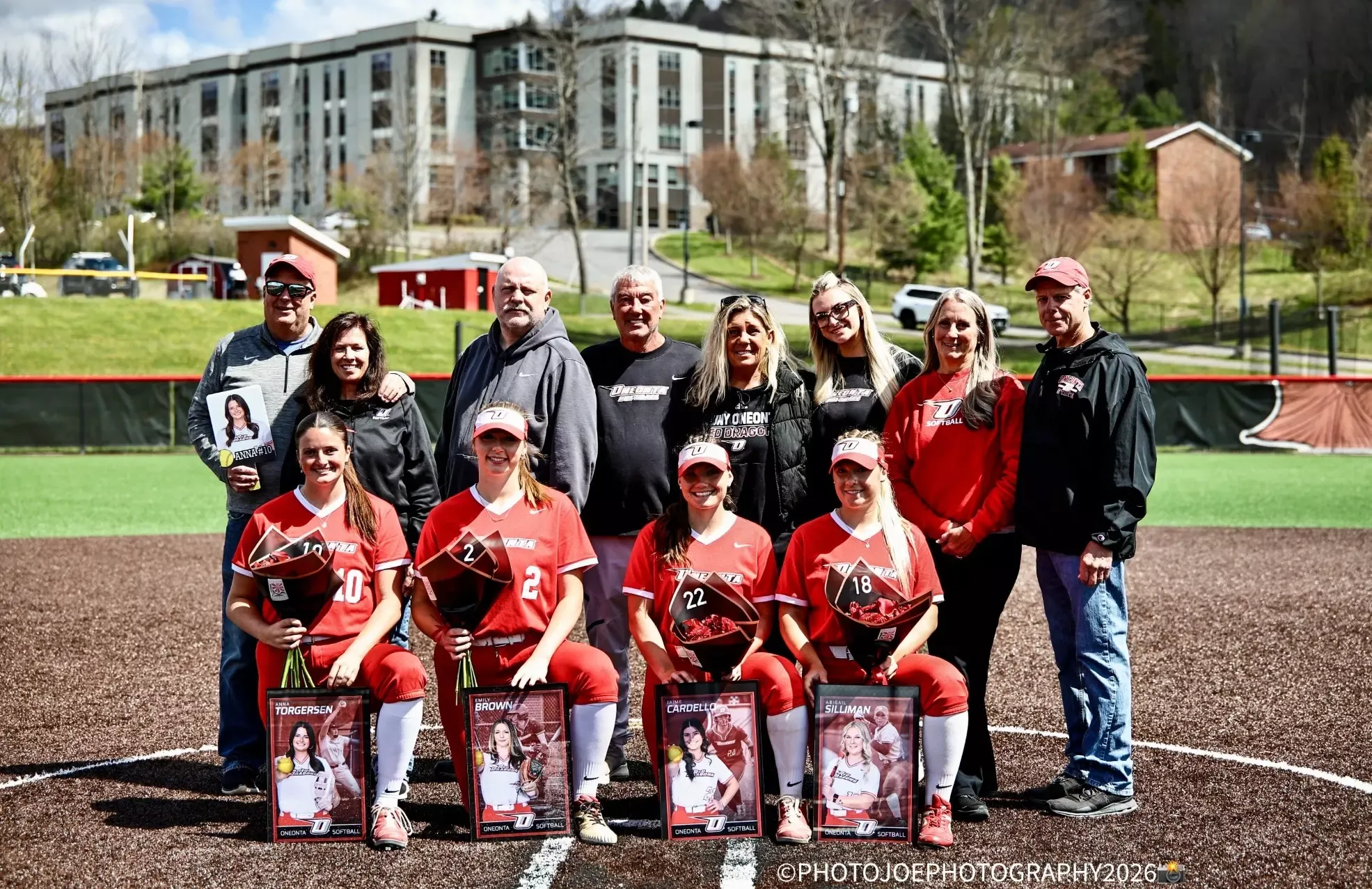 Softball's 2026 seniors take a group pic with their families for Senior Day