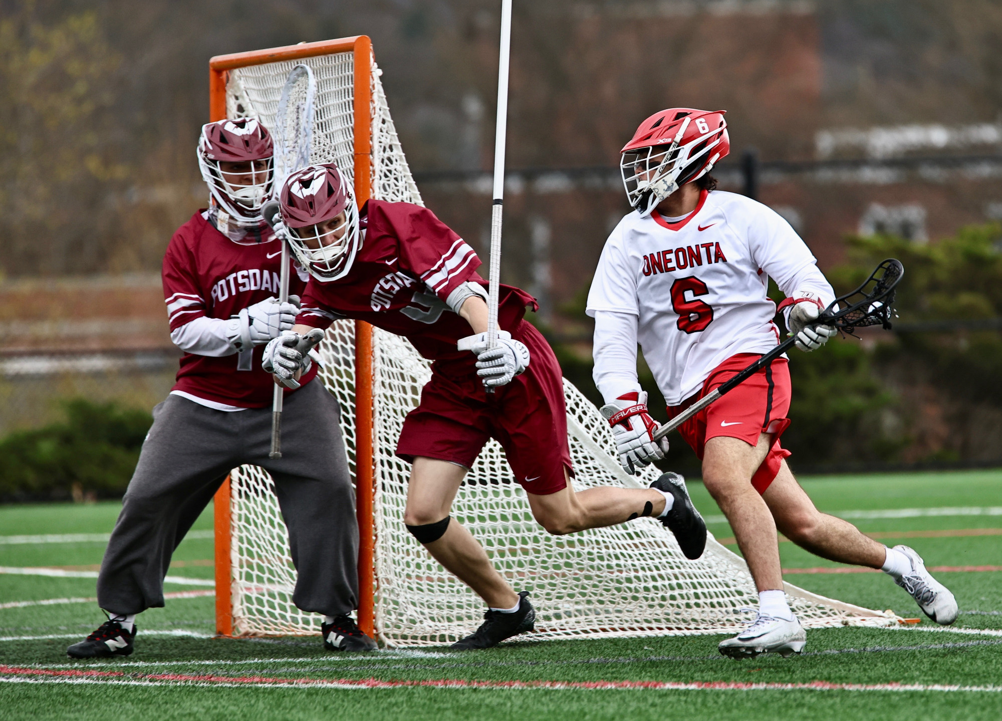 Thomas Hnis wraps around towards the front of the net to score against Potsdam