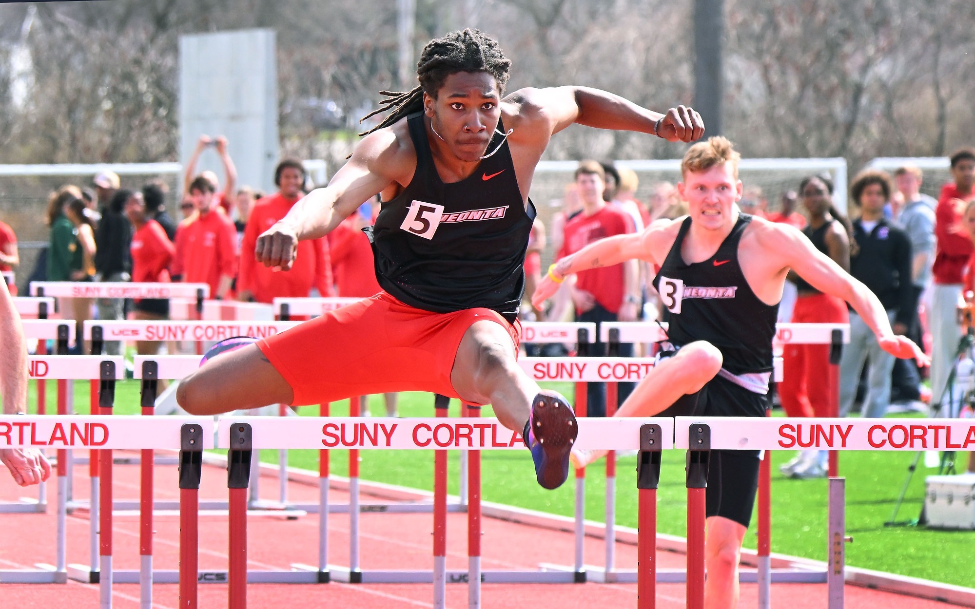 Tariq Earl running the 110-hurdles event